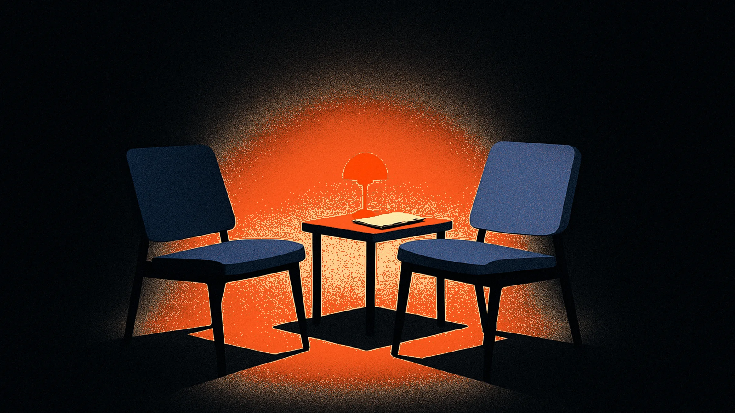 Two chairs side by side facing the same direction in a pool of light, sharing a small table with a glowing orange reading lamp.