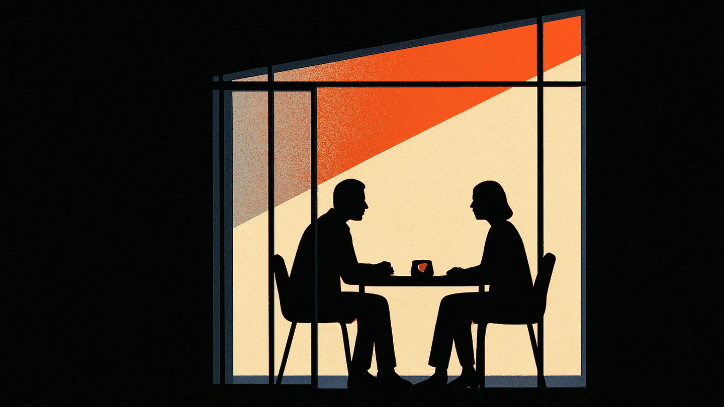 Two silhouetted figures across a small table in a glass-walled room, a single ember-orange dot glowing on a device between them.