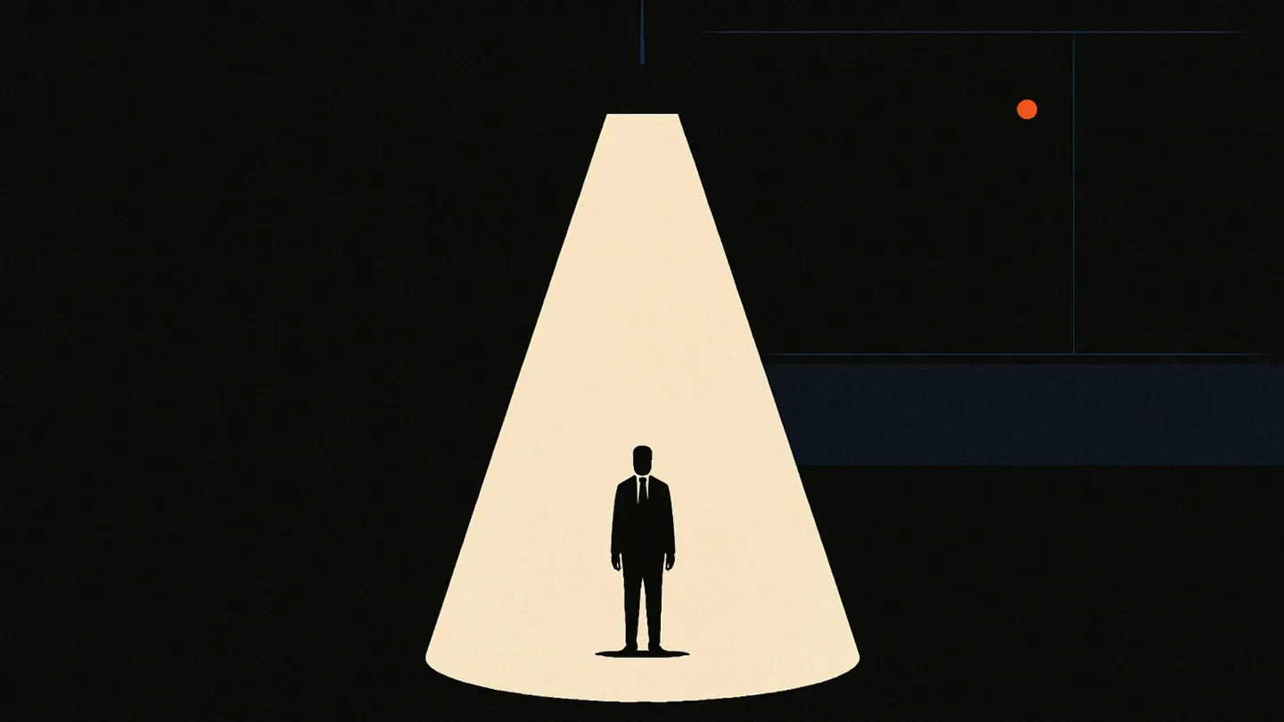 A tiny silhouetted rep stands in a huge dark room beneath a single harsh cone of light, watched by a distant wall of glass.