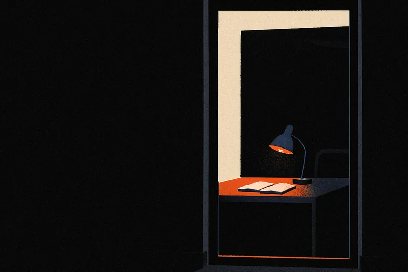 A dim office corridor seen through a tall window, a desk lamp lighting a notebook inside, an ember-orange line along the window's base.